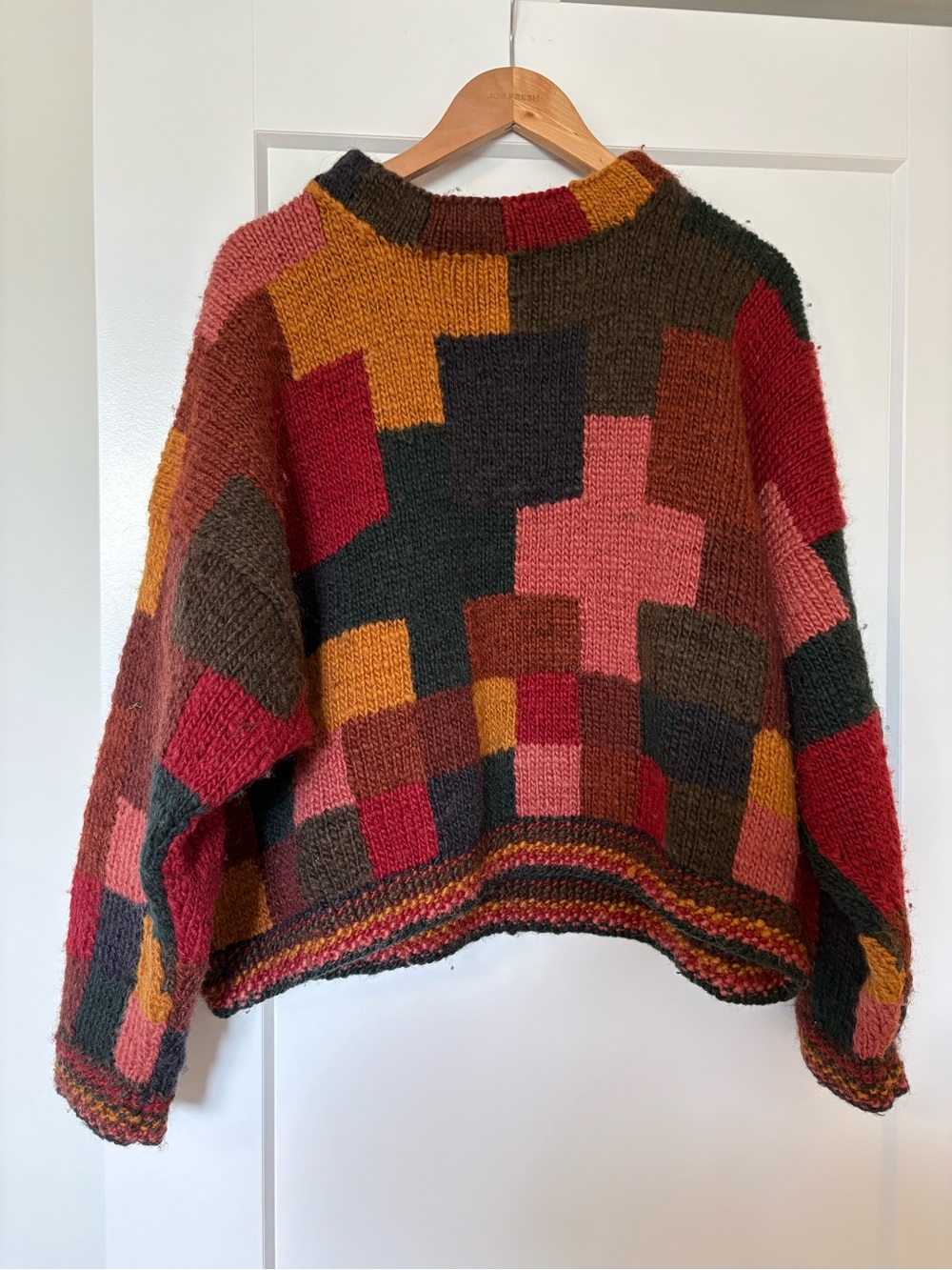 Vintage-style, Hand-knit oversized patchwork wool sweater .